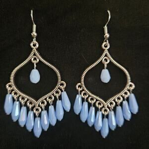 Antique silver arabesque and opaque light blue glass dagger chandelier earrings